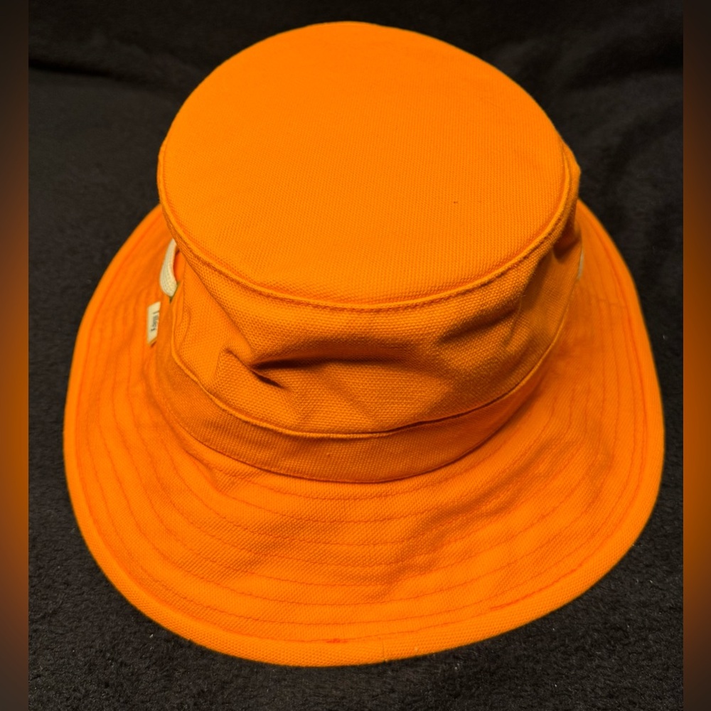 The Tilley bucket hat. Orange. Used in good condition.